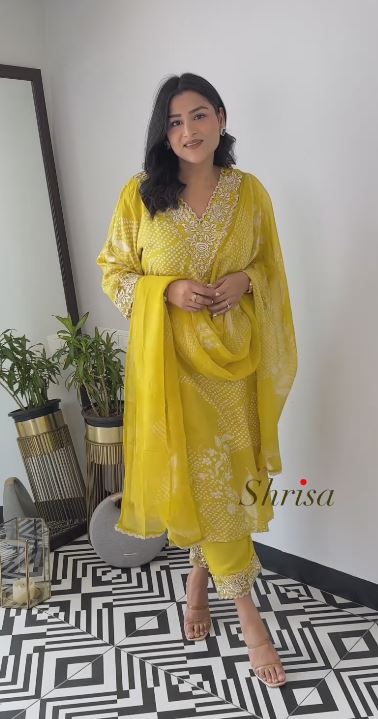 Emroided Yellow Schiffly Suit With Organza Dupatta